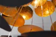 Lampe suspendue de design boule en métal coloris doré et noir