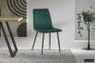 Chaise design en velours coloris vert, pieds noirs