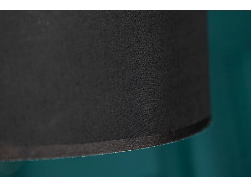 Lampadaire design en métal noir avec abat-jour noir et doré